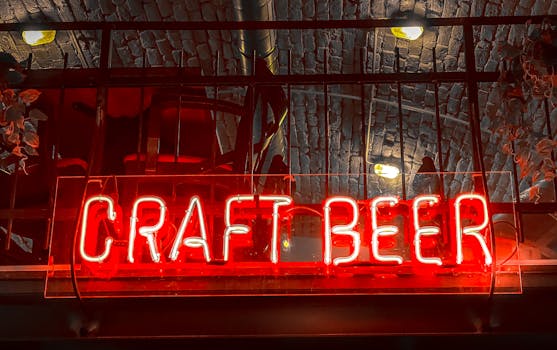 Vibrant red neon sign for craft beer at a bar in Budapest, Hungary.